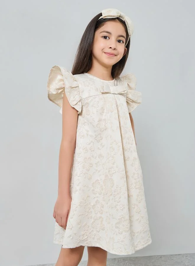 ستايلي فستان جاكار بطبعة أزهار وتفاصيل كشكش للبنات